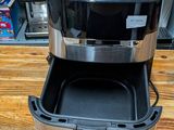 an image of a toaster sitting on a wooden table