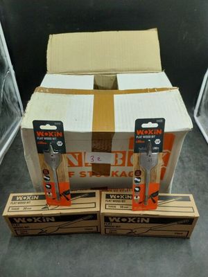 three boxes of toothbrushes sitting on top of each other