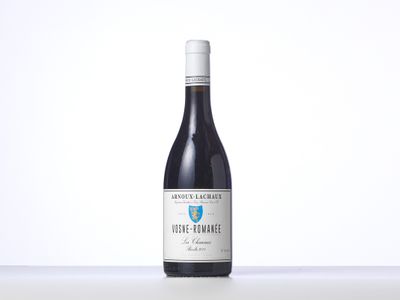 a bottle of red wine sitting on top of a table