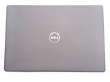 dell laptop computer with dell logo on the back of it