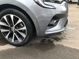 a close up view of a car ' s wheels and rims
