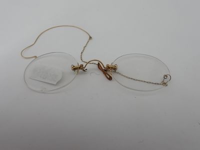 an image of a pair of glasses sitting on top of a table