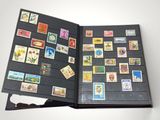 a black book with a bunch of stamps on it