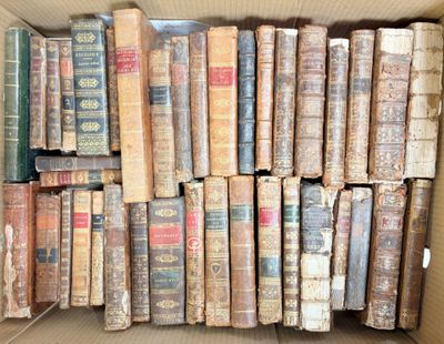 a box full of old books sitting on the floor