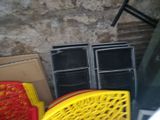 a yellow chair sitting next to a stack of boxes