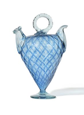 a blue glass vase with a handle on a white background
