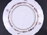 a white plate with a floral design on it
