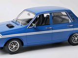 a blue car that is sitting on a white surface
