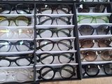 many pairs of glasses sitting in a black case