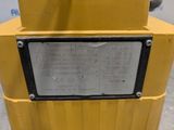 a close up of a sign on the side of a yellow machine