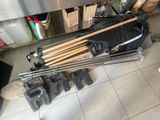 a skateboard that is sitting on the floor next to a bunch of tools