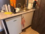 a small kitchen with a sink and a dishwasher in it