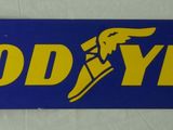 a good year sign hanging on the wall of a building