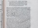 an open book with a black and white image of a letter b on it