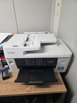 a printer that is sitting on top of a desk