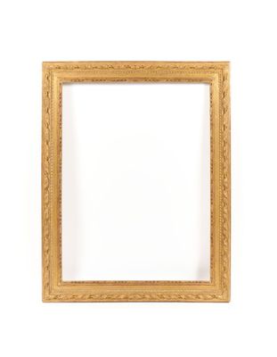 a gold frame on a white wall with a white background