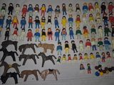 a lot of toy figurines that are on a table
