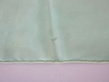 a close up of a piece of fabric with a piece of cloth on it
