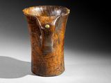 a wooden vase that is sitting on a table