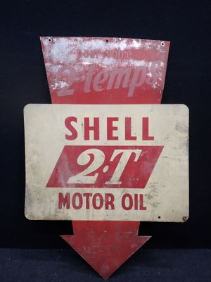 un panneau rouge et blanc sur lequel est inscrit « Shell Oil »