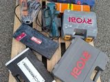 a pile of tools on a pallet on the ground