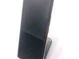 a cell phone that is sitting on top of a stand