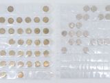 many different types of coins in a plastic bag