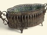 a large metal bowl that is sitting on a table