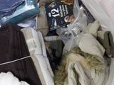 a bag full of clothes and other items that are in it