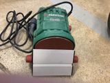 a picture of a park side electric sander on the floor
