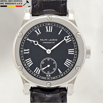 a black watch with roman numerals on the face