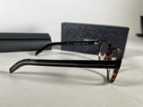 glasses are sitting on a table next to a pair of glasses