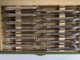 a box full of knives that are sitting on a table