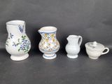 several different types of vases and bowls are lined up on a table