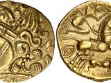 a gold coin with an image of a man riding a horse
