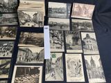 some old black and white pictures of buildings and buildings on a table