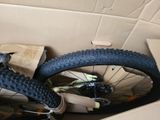 a bike in a box with a box of other items