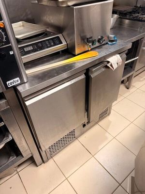a kitchen with a lot of stainless steel appliances in it
