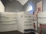 a room with shelves and a bench in it