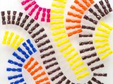 a lot of different colored clips on a white surface