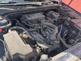 an image of a car with its hood open and the engine in the trunk