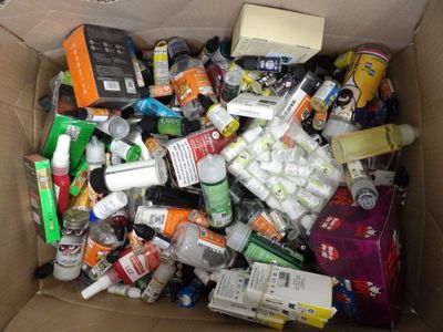 a cardboard box filled with assorted items in it