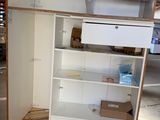 an image of an open refrigerator in a garage