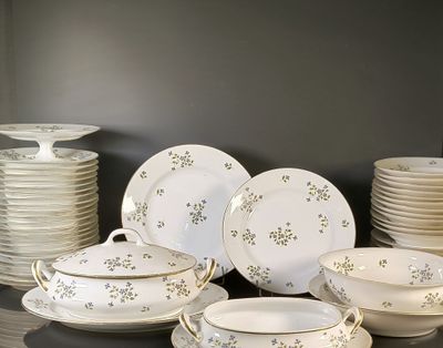 a lot of plates and bowls on the table