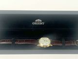 an image of a watch in a black box on a white surface