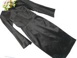 a picture of a black dress with a flower on top of it