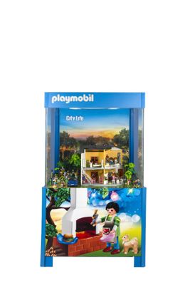 un gros plan sur une boîte de Playmobil contenant une maison de poupées
