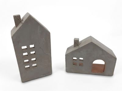 deux maisons en béton sur fond blanc