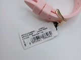 a pink watch with a barcode on the strap