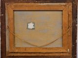 an old picture frame with a piece of paper in it